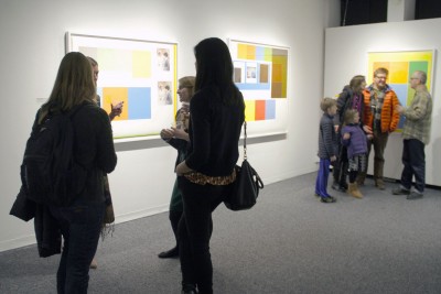 Boston University students and faculty view artwork at the premier of “The Beatles are Dull and Ordinary,” an exhibit by artist David X. Levine, in the Sherman Gallery Friday. PHOTO BY SARAH SILBIGER/DAILY FREE PRESS STAFF